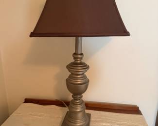 Pewter-tone urn form table lamp with brown bell shade