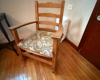 Wooden ladder-back armchair with floral upholstered seat cushion