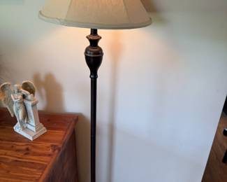 Bronze finish floor lamp with bell-shaped fabric shade