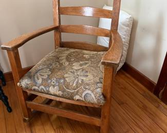 Oak ladder-back armchair with floral upholstered seat cushion