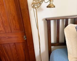 Antique brass gooseneck floor lamp with ornate scrolled arm