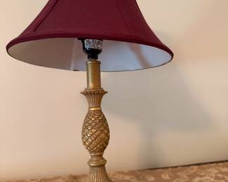 Brass pineapple table lamp with burgundy bell shade
