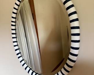 Round wall mirror with black and white striped frame