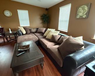 Living room view with sectional sofa and coffee table