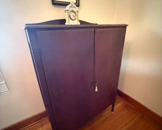 Antique mahogany two-door wardrobe cabinet with cabriole legs and key