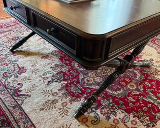 Dark wood coffee table with two drawers and spindle legs