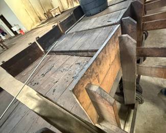 Antique wooden farm wagon bed with side rails