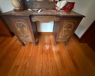 Antique wood vanity with carved mirror back and ball feet