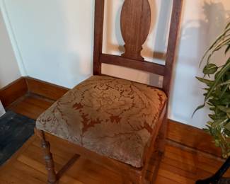 Antique oak side chair with carved splat back and floral seat