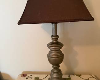 Pewter-tone candlestick table lamp with brown fabric shade