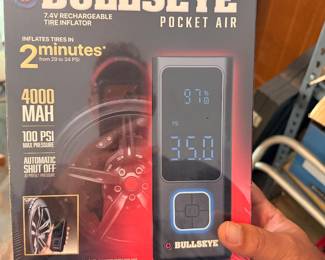 This item is a brand-new-in-box Bullseye Pocket Air 7.4V Rechargeable Tire Inflator, which serves as a portable cordless air compressor and an emergency power bank