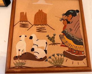 vintage Navajo sandpainting depicting a traditional southwestern scene with a Navajo figure, sheep, and iconic desert buttes