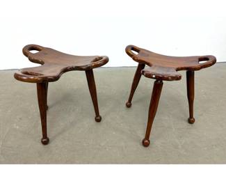 Lot 711 Pair of sculptural hardwood tripod stools with tri lobed seats and ball feet. Marbella style.