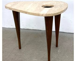 Lot 759 Modernist Travertine Triangle Guitar Pick Side Table. Top has cut out.