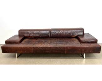 Lot 1219 Modern low profile 3 seat sofa in distressed brown leather with polished chrome sled legs. Unsigned.