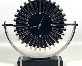 Lot 765 GLOBAL VIEWS Contemporary Modern Starburst Mantel Clock. Nickel Plated Rectangular Bars and Black Ba