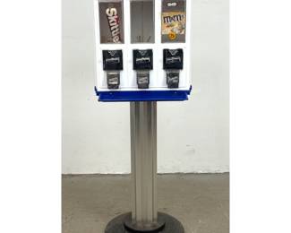Lot 1242 NORTHWESTERN Triple Play Bulk Vending Machine on Pedestal Stand. Vends three snack options. Has Key