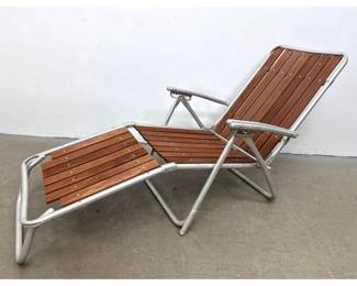 Lot 1275 Vintage folding aluminum and redwood slatted outdoor lounge chair. Mid Century Modern style. Unsigne