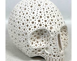 Lot 881 Alexander Ney reticulated Terracotta skull sculpture. Off white matte finished clay with geometric p