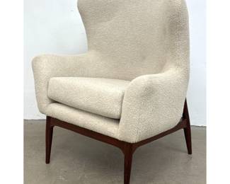Lot 710 Contemporary Modern Lounge Chair. Egg form back on Tapered wood legs.