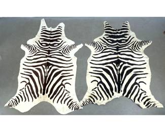 Lot 1046 2pcs Zebra Printed Natural Cow Hide Rugs.