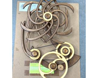 Lot 941 David C. Roy Ellipse Kinetic Wood Wall Sculpture. Stained Birch Plywood with Spring Drive Mechanism