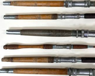Collection of vintage one piece bamboo fishing rods