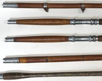 Collection of vintage one piece bamboo fishing rods