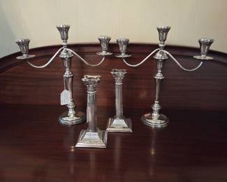 Pair of Sterling Silver candelabras marked Kentshire, and a pair of single sticks silver on copper circa 1890.