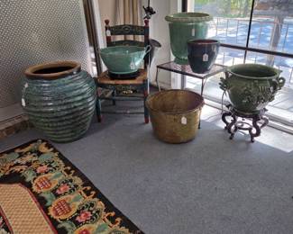 Collection of garden containers and a heavy brass bucket.