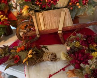 Fall foliage arrangement in wheel barrow
