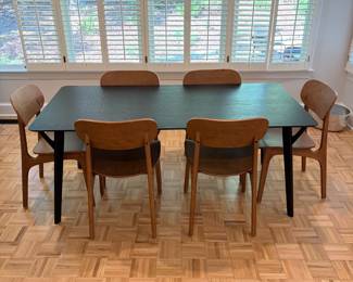F61 - $300. Black Dining Room Table with 6 Wooden Chairs. All are newer and made to look like MCM furniture! Table measures 71" x 35.5" x 29.5" tall. Chairs are 19.5" wide x 21" deep x 33.25" tall. Seat to floor is 18".  Excellent condition and very gently used!