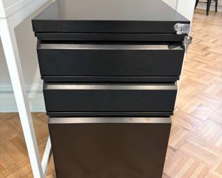 F70 - $40. Locking, Rolling, Metal Filing Cabinet. Measures 15.5" x 20" x 24.5" tall. One large file drawer, 2 smaller drawers. 
