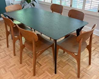 F61 - $300. Black Dining Room Table with 6 Wooden Chairs. All are newer and made to look like MCM furniture! Table measures 71" x 35.5" x 29.5" tall. Chairs are 19.5" wide x 21" deep x 33.25" tall. Seat to floor is 18".  Excellent condition and very gently used!