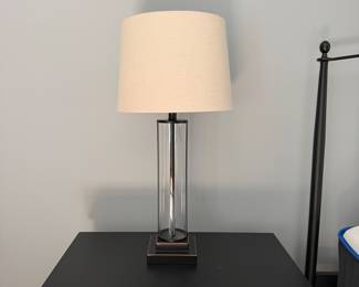 F36 - $125. PAIR of Uttermost Modern Cylindrical Glass Table Lamps. Measures 29" tall. Shades are in perfect condition. 