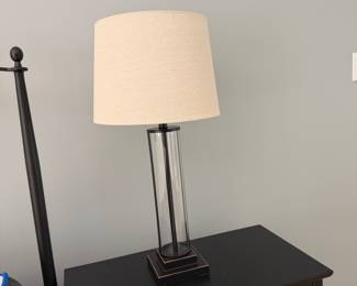 F36 - $125. PAIR of Uttermost Modern Cylindrical Glass Table Lamps. Measures 29" tall. Shades are in perfect condition. 