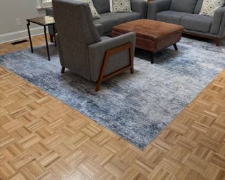 F11 - $100. Washable "Indoor Rug" with pad included. Measures approximately 10' x 14'. 