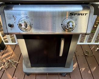 F63 - $100. Weber Spirit Grill. Propane tank is included (and 1/2 full!) Gently used - stored uncovered so there is very minor rust & fading.  