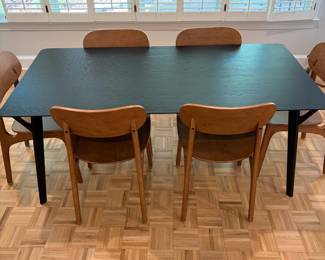 F61 - $300. Black Dining Room Table with 6 Wooden Chairs. All are newer and made to look like MCM furniture! Table measures 71" x 35.5" x 29.5" tall. Chairs are 19.5" wide x 21" deep x 33.25" tall. Seat to floor is 18".  Excellent condition and very gently used!