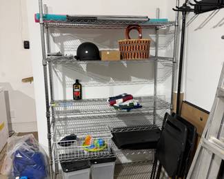 F87 - $50. Metal Garage Shelving Unit. Measures 4’ x 18” x 72” tall. 
