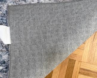 F11 - $100. Washable "Indoor Rug" with pad included. Measures approximately 10' x 14'. 