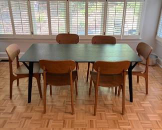 F61 - $300. Black Dining Room Table with 6 Wooden Chairs. All are newer and made to look like MCM furniture! Table measures 71" x 35.5" x 29.5" tall. Chairs are 19.5" wide x 21" deep x 33.25" tall. Seat to floor is 18".  Excellent condition and very gently used!
