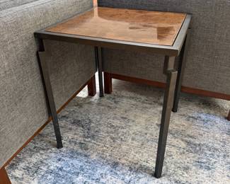 F10 - $200. PAIR of heavy metal framed side tables by Robert Augstell. . Wooden tops have uneven lacquer finish. Measures  20" square x 22.5" tall. 