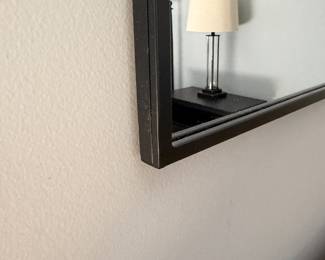 F38 - $40. Wall Mirror from Origin 2l - Black Metal Frame. Measures 40" x 30" 
