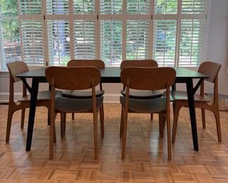 F61 - $300. Black Dining Room Table with 6 Wooden Chairs. All are newer and made to look like MCM furniture! Table measures 71" x 35.5" x 29.5" tall. Chairs are 19.5" wide x 21" deep x 33.25" tall. Seat to floor is 18".  Excellent condition and very gently used!