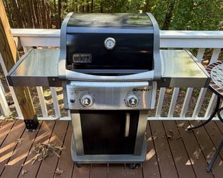 F63 - $100. Weber Spirit Grill. Propane tank is included (and 1/2 full!) Gently used - stored uncovered so there is very minor rust & fading.  