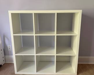F31 - $40. 9 Cube Cubby Shelf in White. 