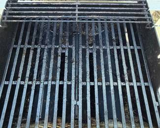 F63 - $100. Weber Spirit Grill. Propane tank is included (and 1/2 full!) Gently used - stored uncovered so there is very minor rust & fading.  
