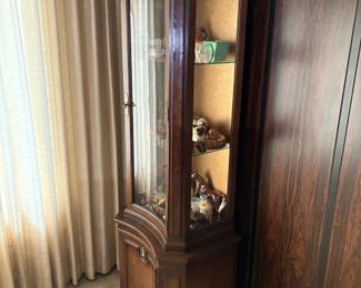 Traditional dark wood curio cabinet