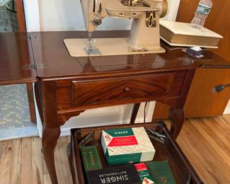Vintage singer sewing machine in walnut cabinet and stool 